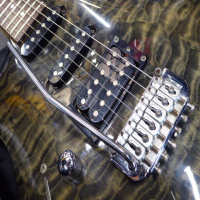 <p>Lovely HSS guitar with quilted maple top and transparent grey finish.&nbsp; Made in Korea (2003/04).</p><p>Condition: A couple of small dents and various pick scrapes and belt-buckle scrapes.</p>